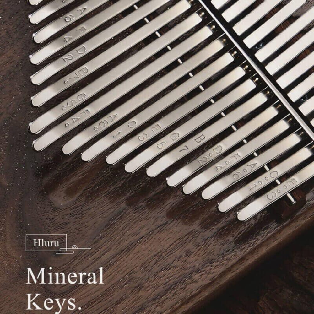 White piano keys in diagonal pattern on 21 Key Black Walnut C Tone Kalimba Thumb Piano