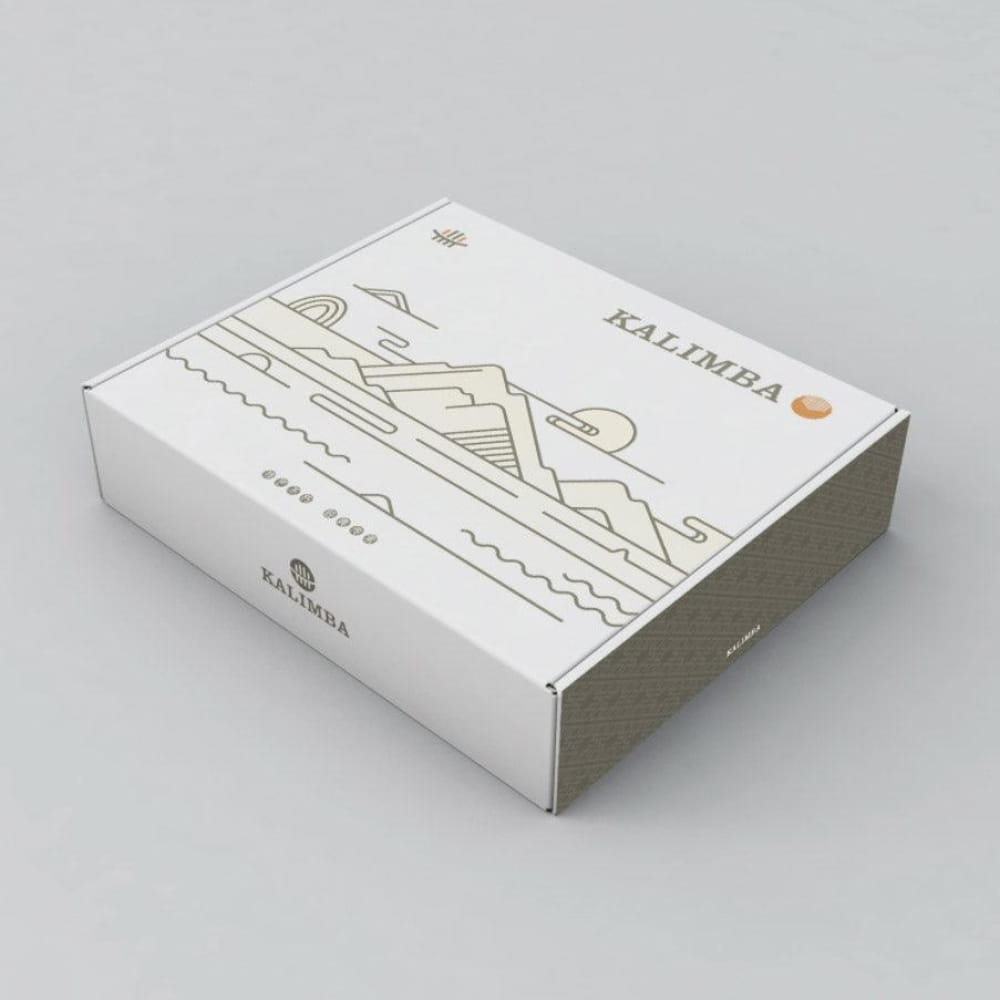 White cardboard box featuring minimalist mountain art and KALIMBA text for 21 Key Kalimba
