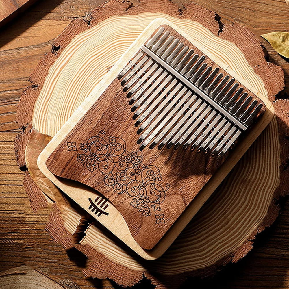 Wooden kalimba thumb piano with carved patterns, perfect for meditation and relaxation