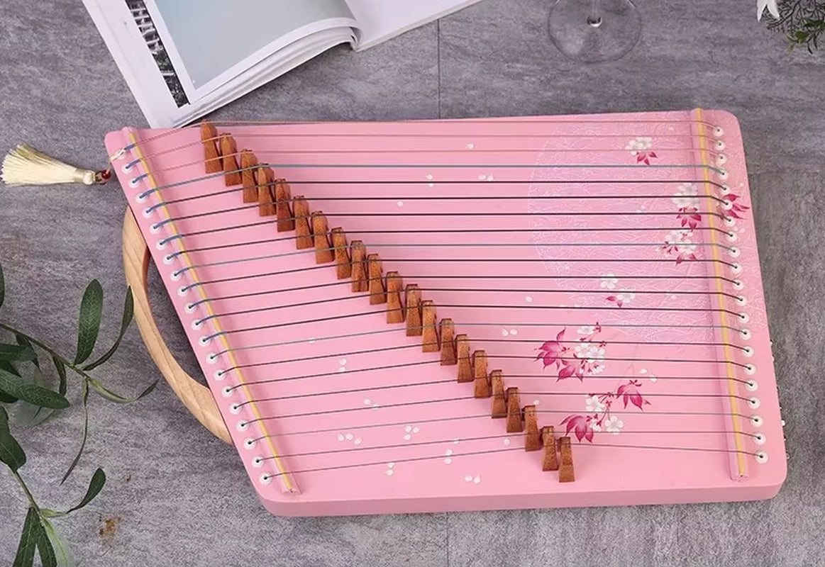 Pink wooden Guzheng with floral decorations and diagonal strings for elegant music