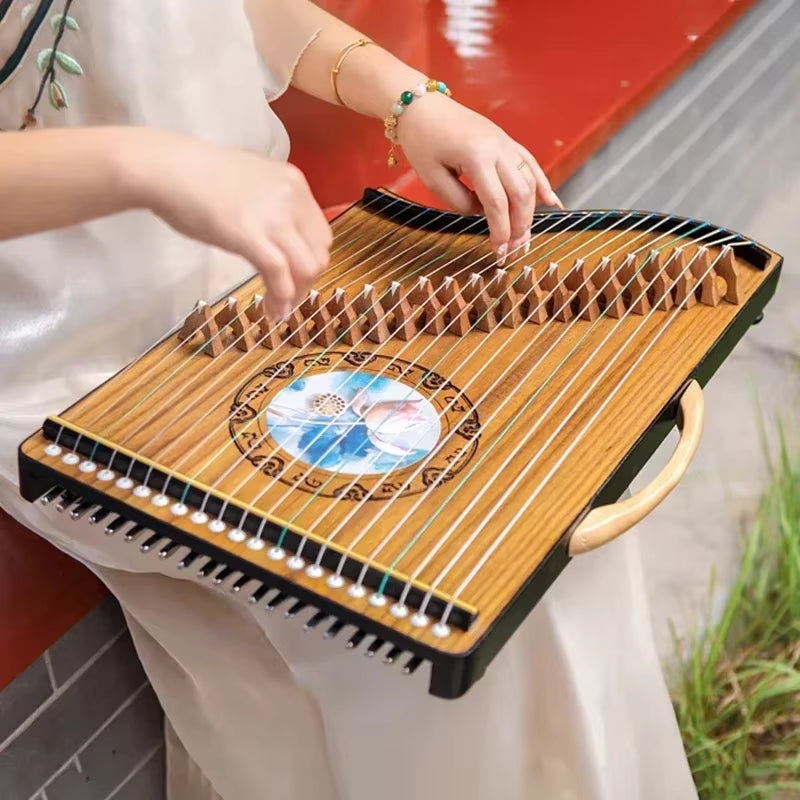 21-String Portable Guzheng with decorative circular design in the center