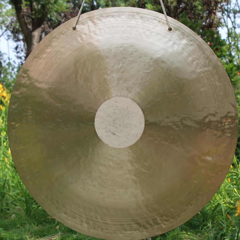 Circular metallic gong with raised center dot from 38 Inch Chinese Wind Gong Instrument