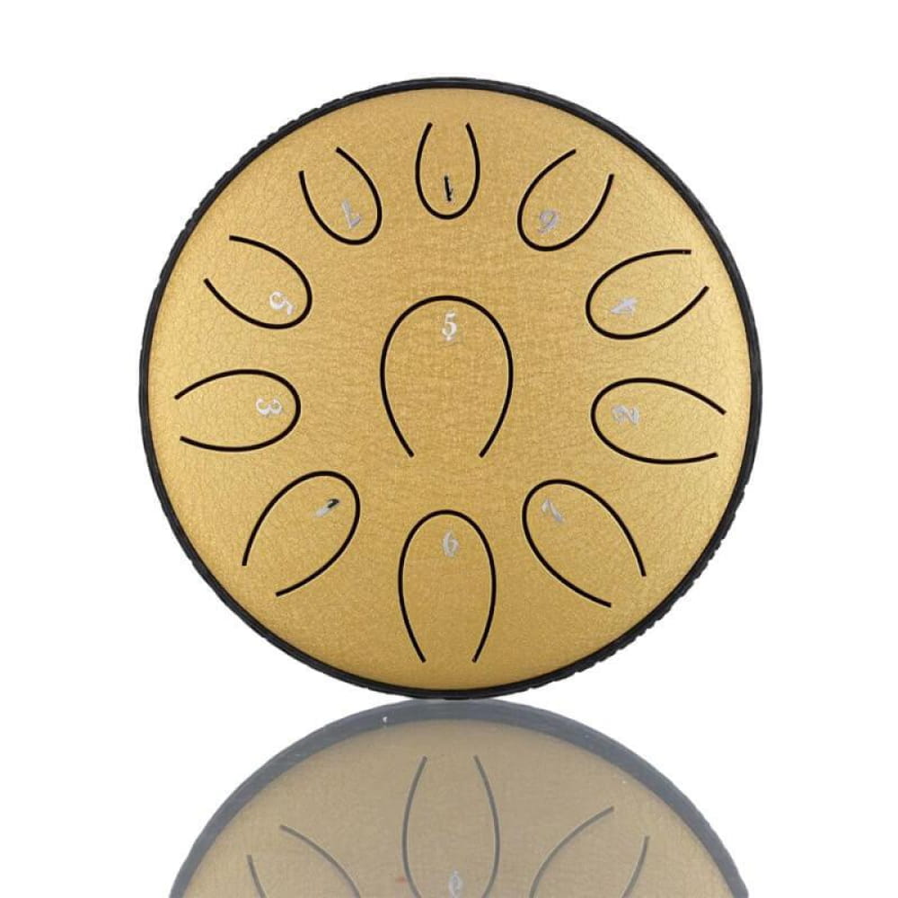 Circular golden tongue drum with petal-like tone slots in sunflower pattern