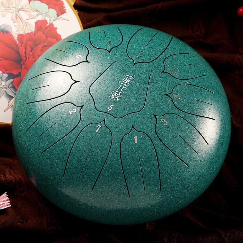 Turquoise steel tongue drum with petal etchings for kids and beginners, 8 notes