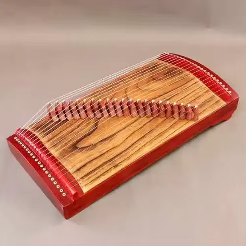 Traditional Chinese Guzheng zither with wooden body and red-painted edges, 68 cm