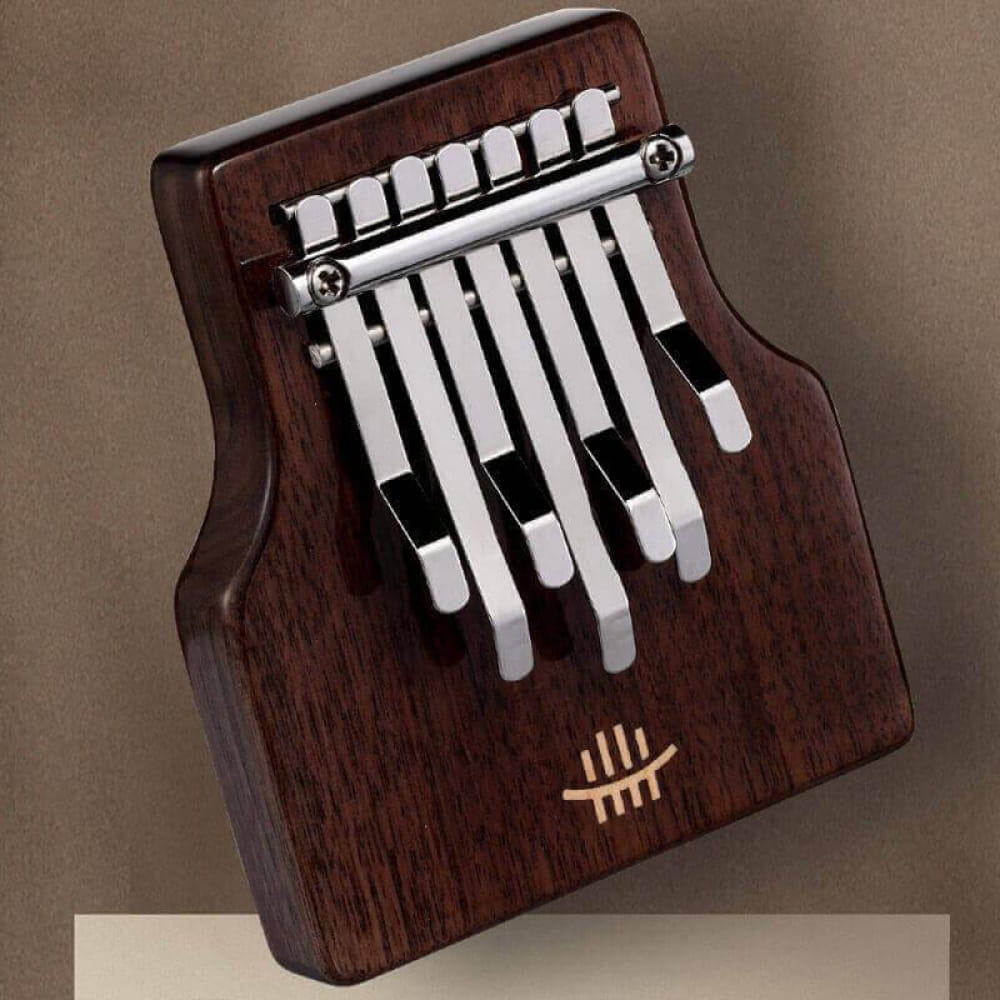 Wooden Kalimba thumb piano with white metal tines in 7-Key C Tone design