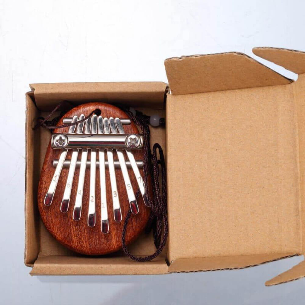 8 Key Portable Thumb Piano for Kids and Adults in a Cardboard Box with Wood and Metal Tines