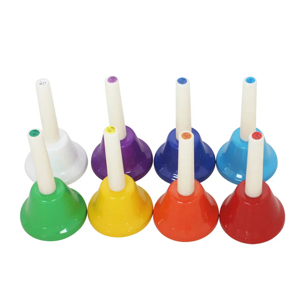Colorful 8-Note Chakra Meditation Hand Bell Set arranged in rainbow sequence