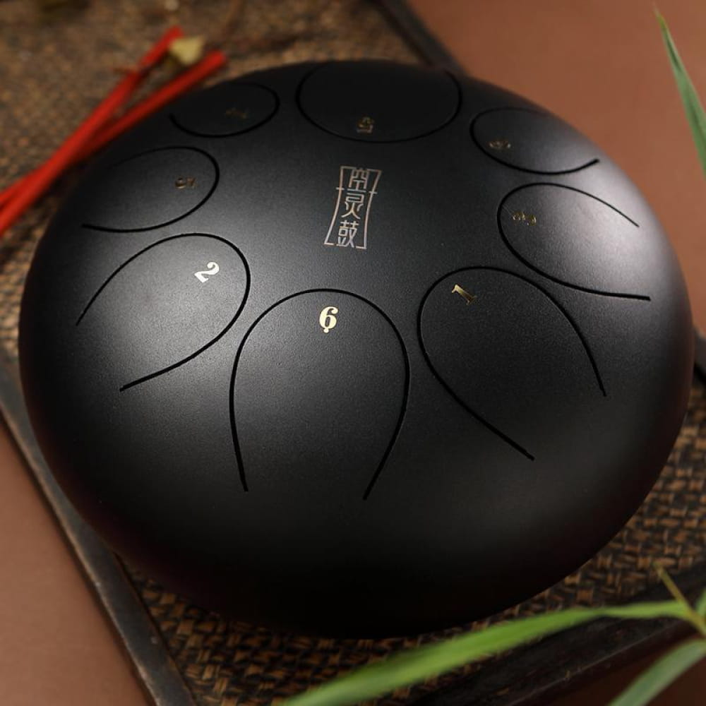 Black steel tongue drum with numbered tone zones in 8-Tone D Key design