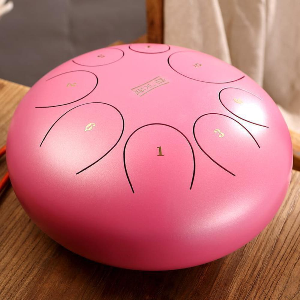 Pink Steel Tongue Drum with numbered tone zones on 10-inch round surface
