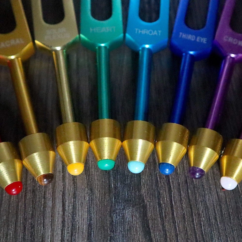 Rainbow metallic acupuncture needles in curved line for Chakra Tuning Fork Set