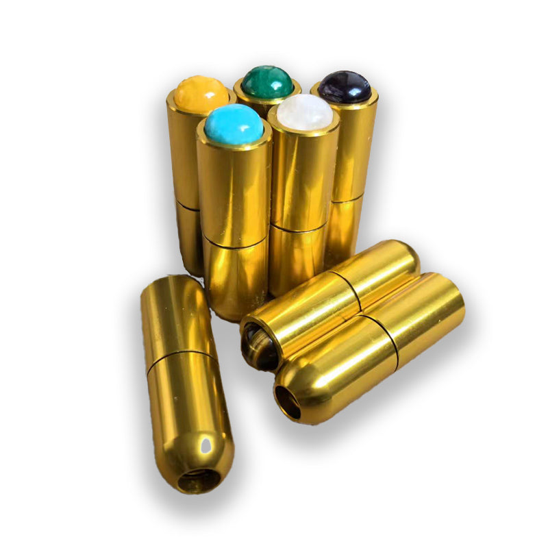 Gold-colored metal inhalers with colorful caps for 93.96 Hz Earth Tuning Fork