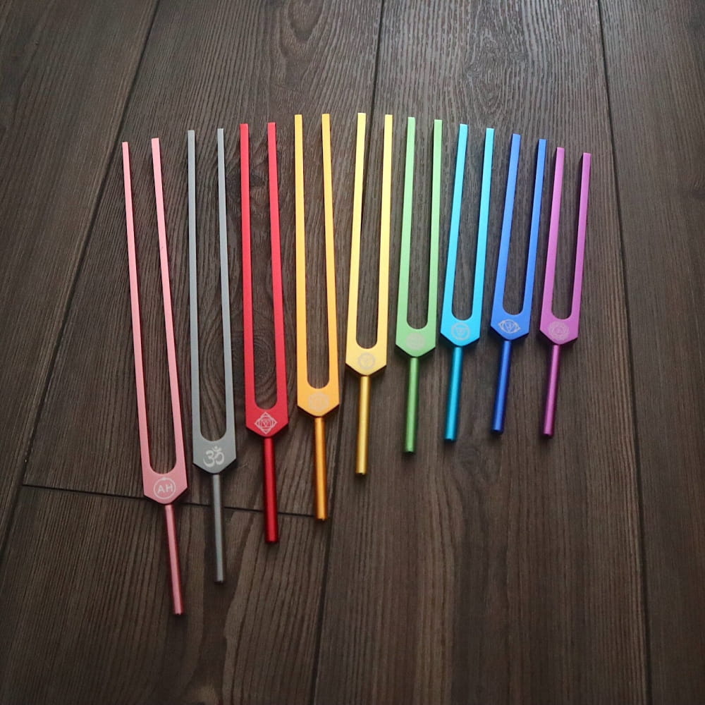 Rainbow-colored tuning forks in chromatic scale for Solfeggio Tuning Fork Set