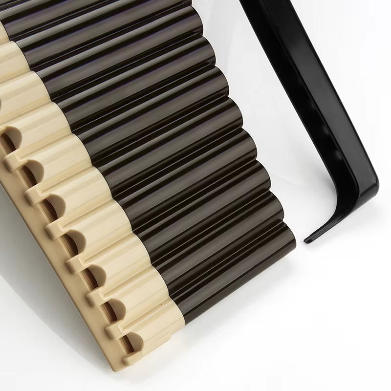 Row of black and beige plastic pen caps for ABS Pan Flute for Beginners C Key