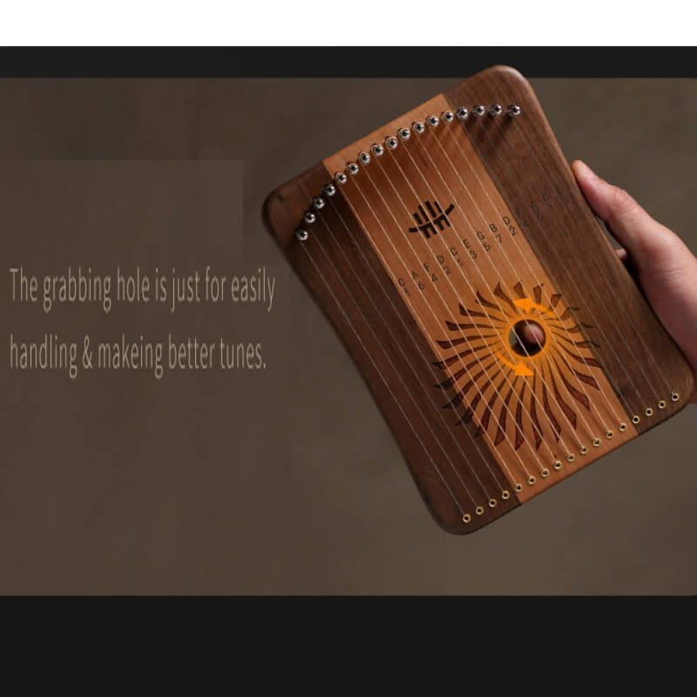 Wooden kalimba thumb piano with sun design and metal tines for adjustable lyre harp