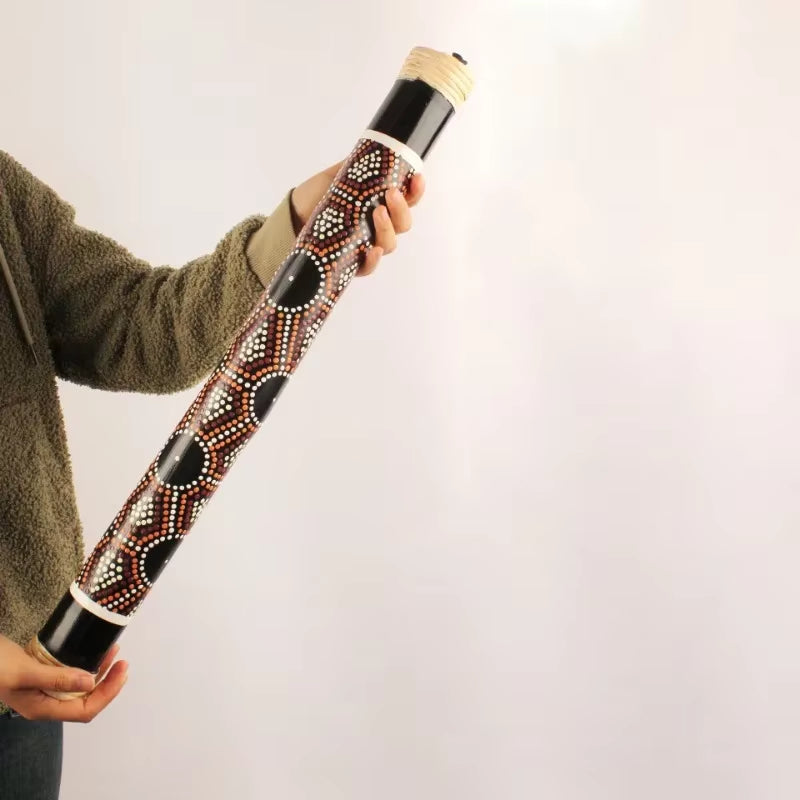 Decorated Didgeridoo featuring traditional Aboriginal dot painting patterns