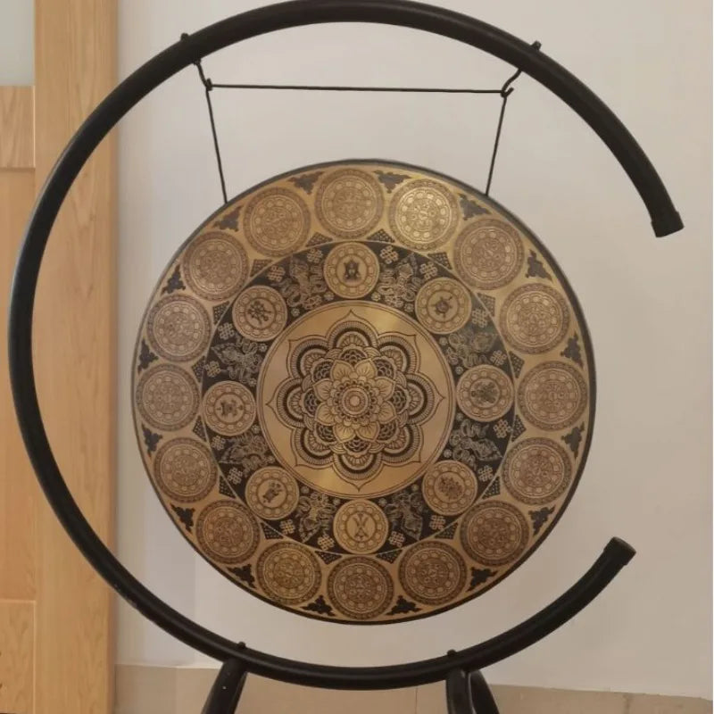 Decorative circular Bronze Therapy Gong with mandala patterns on a C-shaped stand