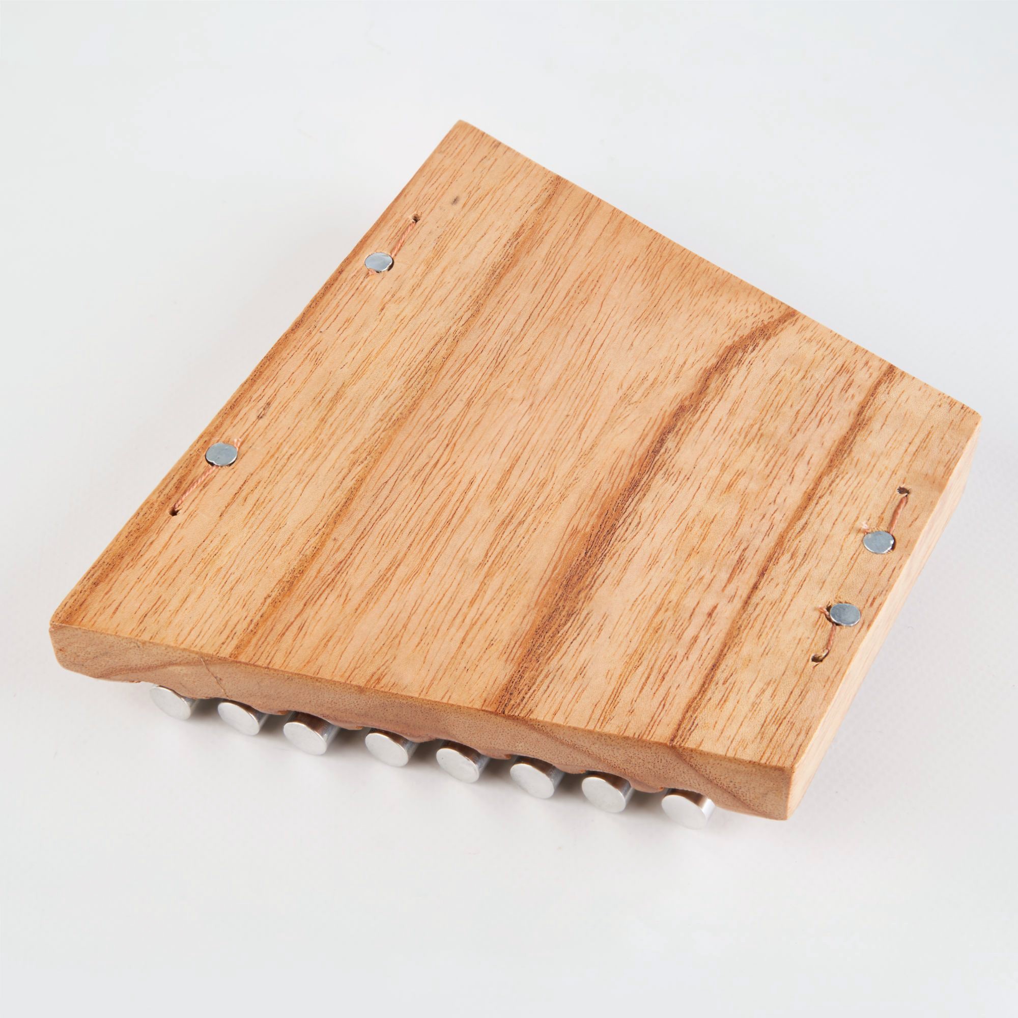 Wooden pan flute with metal fasteners and ridged bottom edge for Chakra Energy Bar Chimes