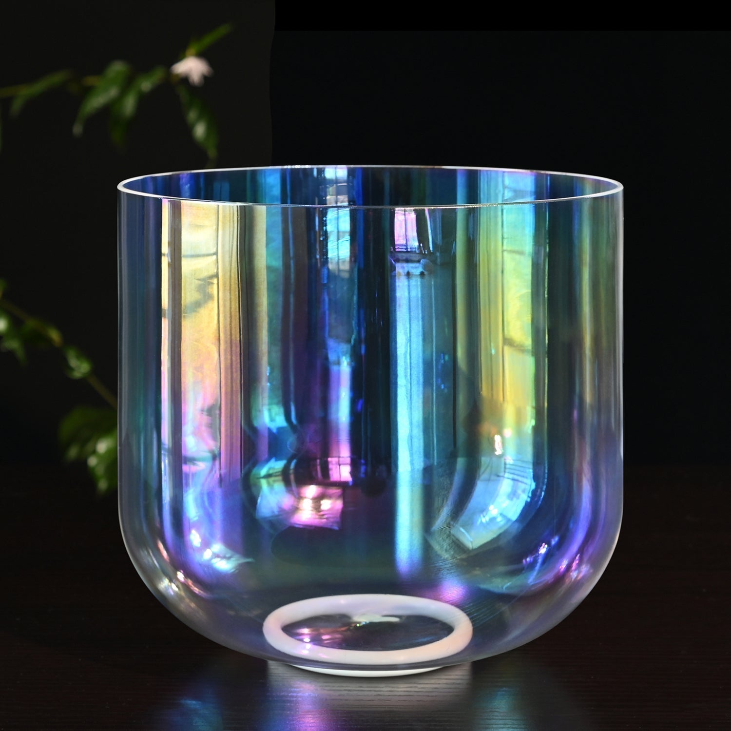 Iridescent glass bowl reflecting rainbows in Clear Rainbow Quartz Crystal Singing Bowl