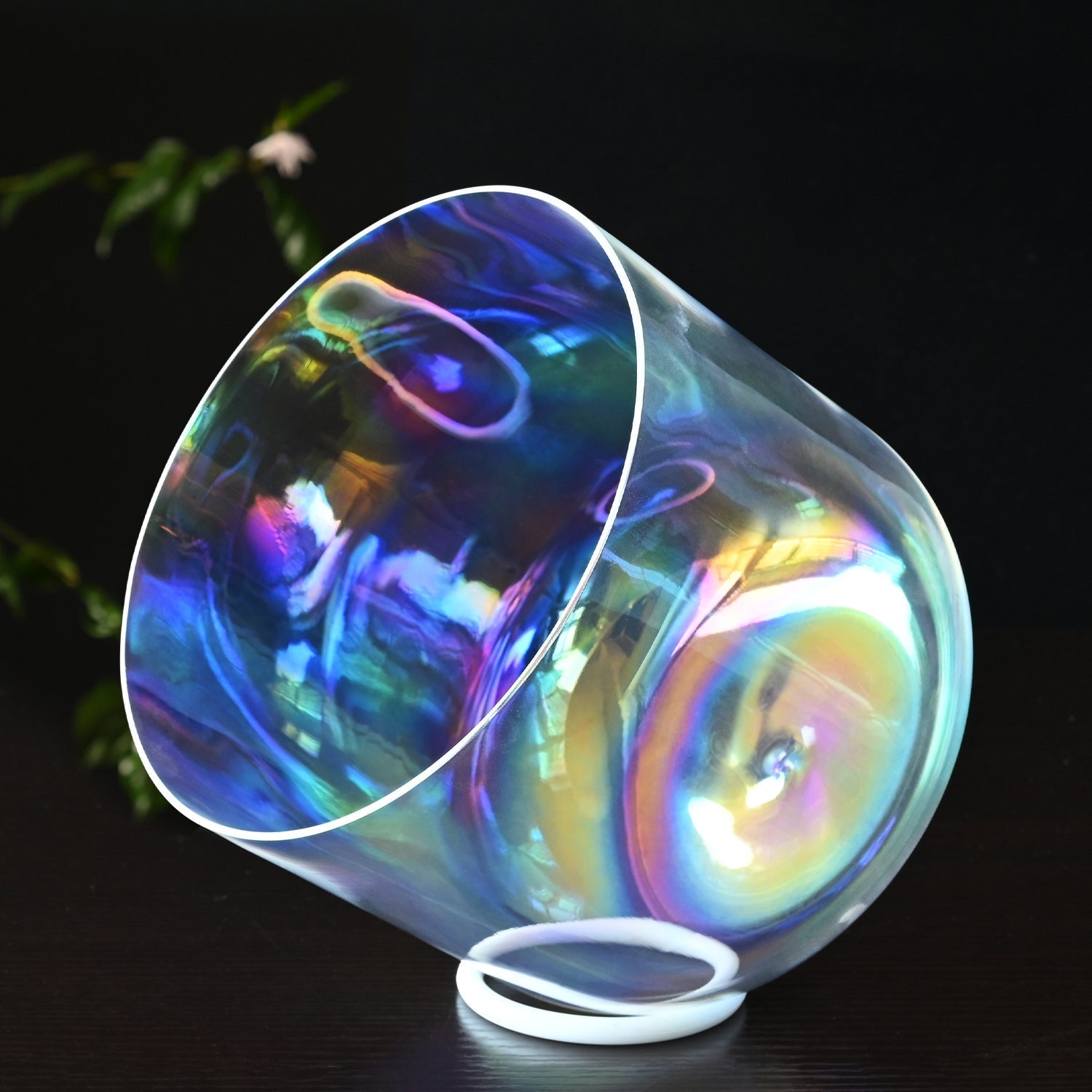 Iridescent glass cup showcasing rainbow reflections, part of Clear Rainbow Quartz Crystal Singing Bowl for Chakra Healing