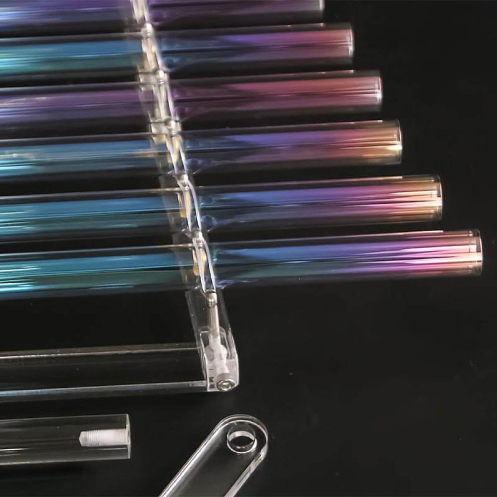 Row of test tubes filled with iridescent liquids for Colorful Quartz Crystal Harp