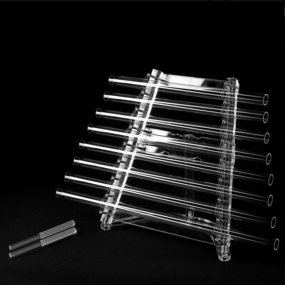 Glass test tubes in a clear plastic rack for Crystal Quartz Singing Harp therapy