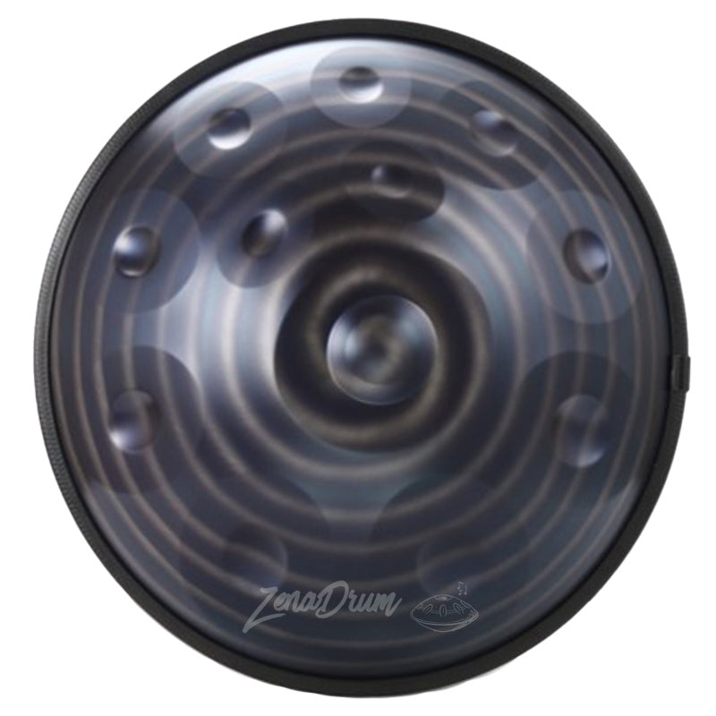 Circular black and gray D Minor Kurd Handpan Drum with spiral pattern and raised dimples