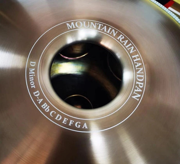 Circular metal tuning peg hole on a Mountain Rain banjo, featured with D Minor Kurd Handpan Drum