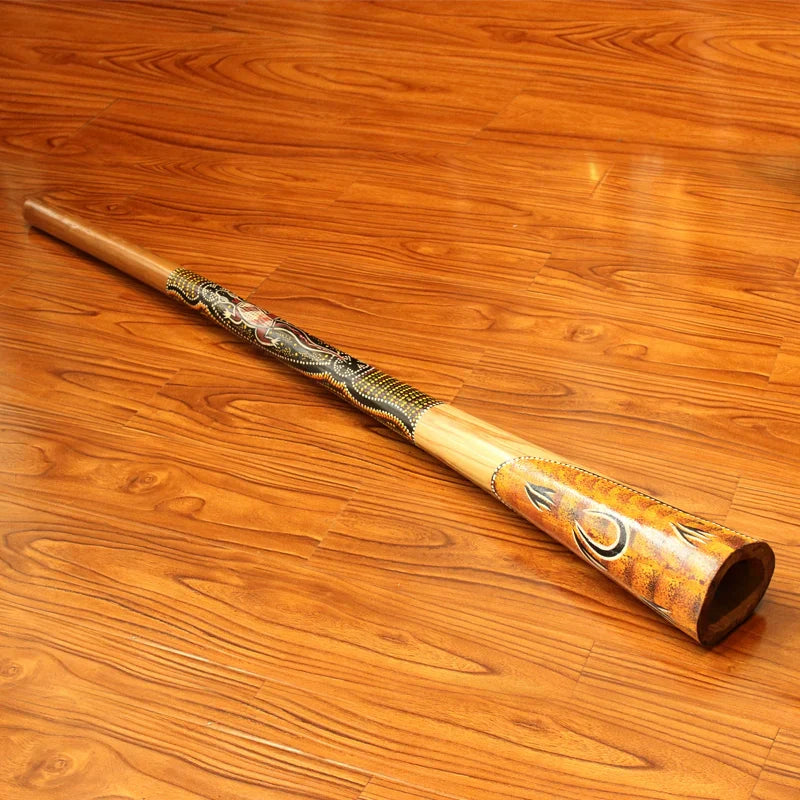 Decorative wooden Didgeridoo with intricate carvings and vibrant painted designs
