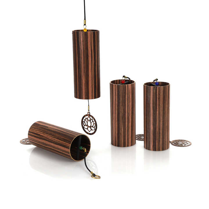 Cylindrical wooden wind chimes with decorative metal tree pendants in Elemental Wind Chimes set