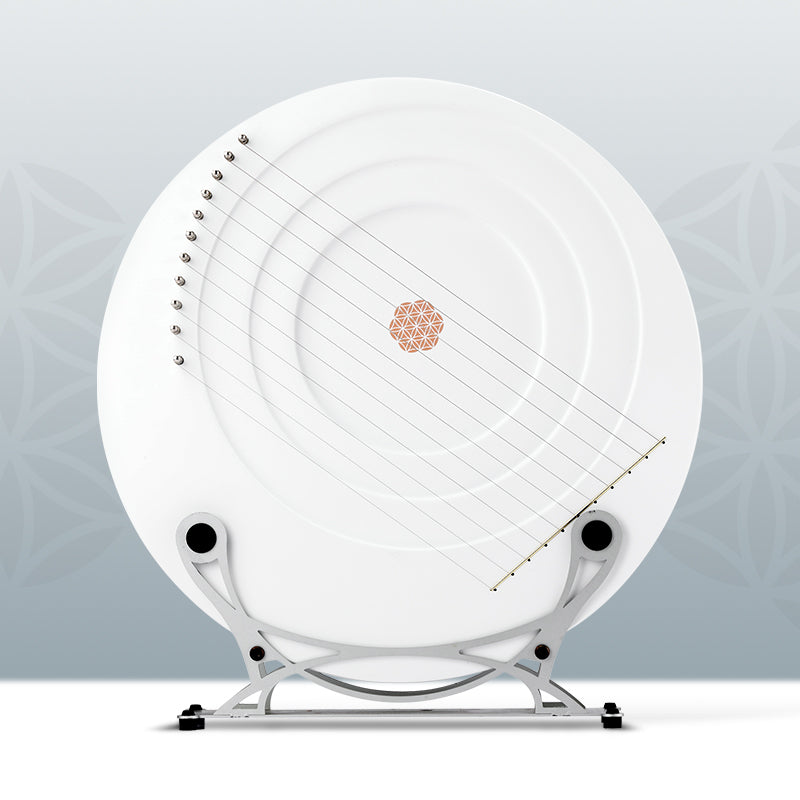 Circular white electronic smoke detector on metal stand for Full Moon Lyre Harp Instrument