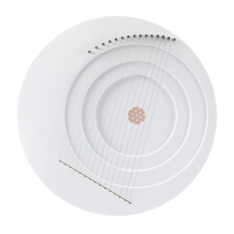 Elegant white ceramic plate with ridges and pink floral design for Full Moon Lyre Harp