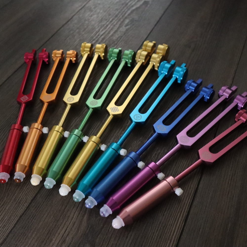Colorful tuning forks in a rainbow pattern for Gemstone Aromatherapy Tuning Forks Extensions