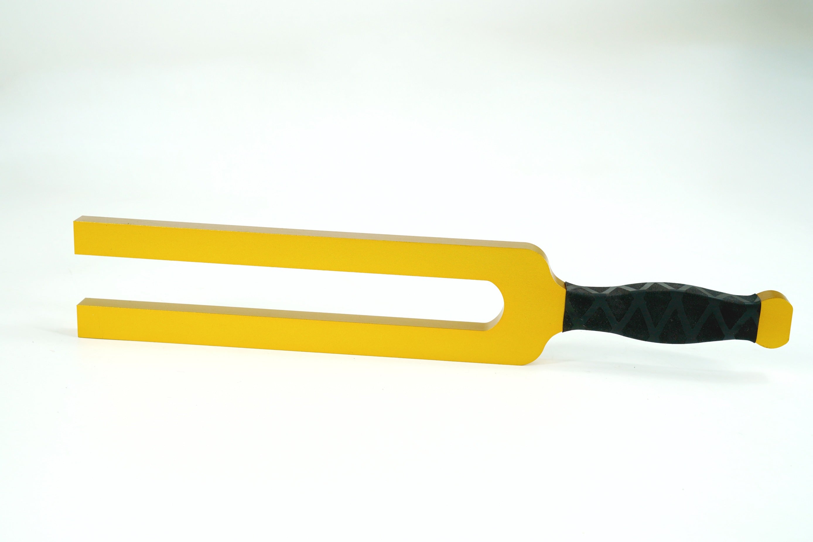 Yellow tuning fork with black rubber handle for Giant Tuning Forks adjustable frequency