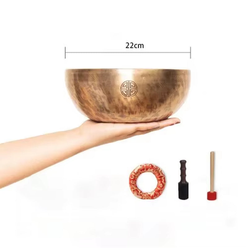 Hand-hammered Tibetan singing bowl with etched symbol for meditation and yoga