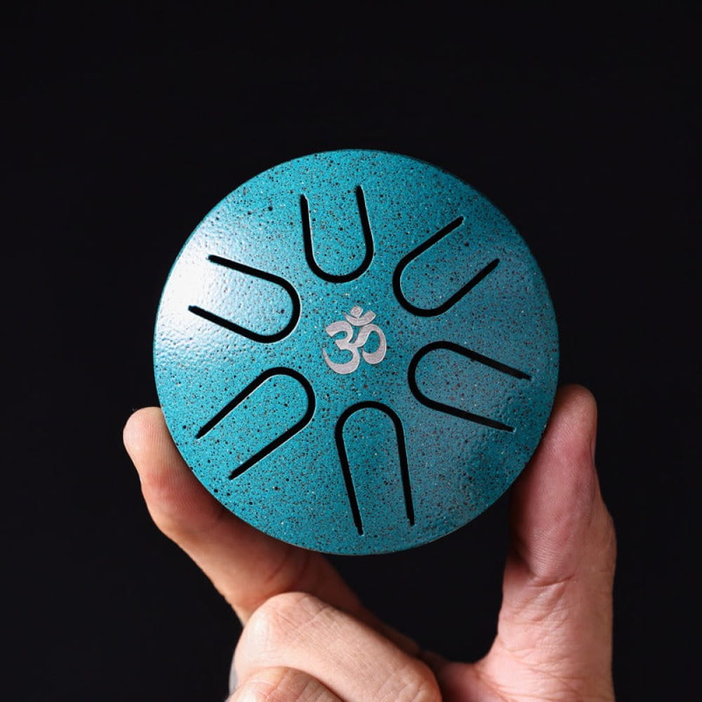 Turquoise Mini Titanium Steel Tongue Drum with Om symbol and curved slits, 3-Inch, 6-Note