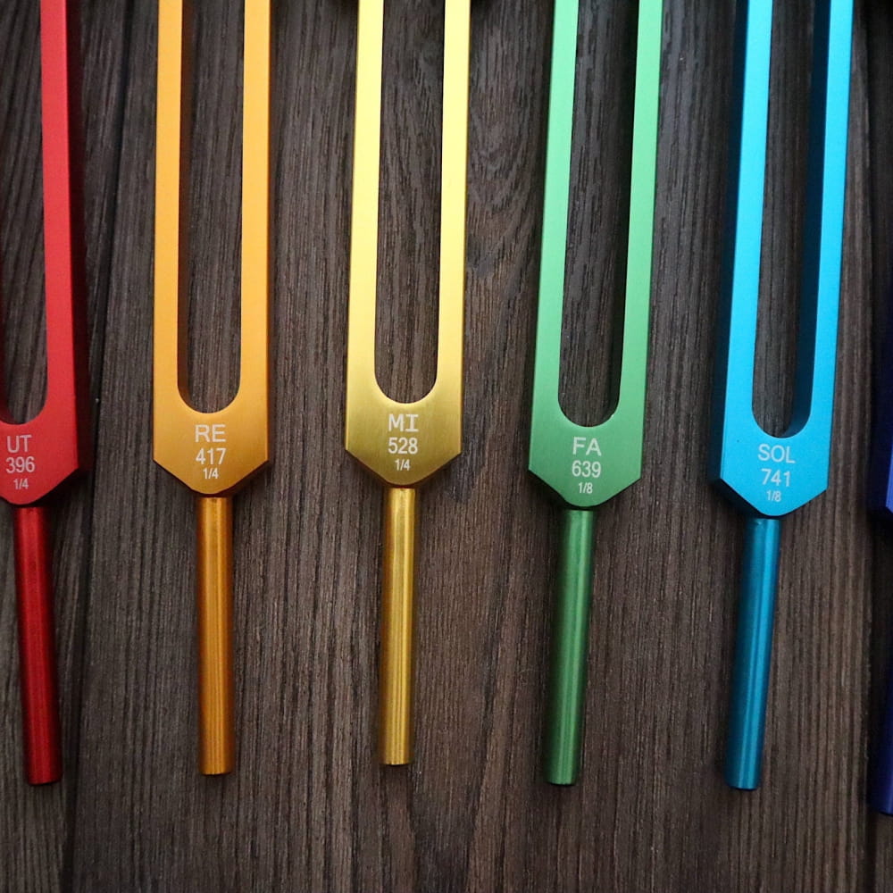 Colorful tuning forks in rainbow sequence from the Professionally Tuned Solfeggio Forks set