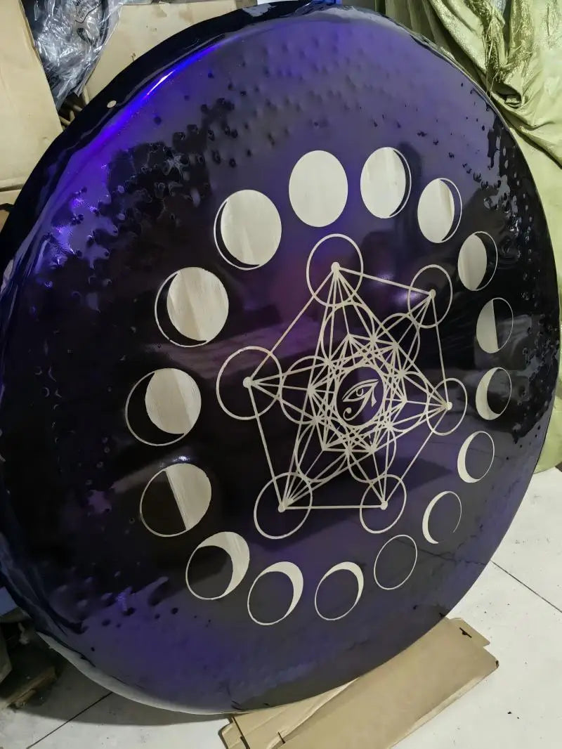 Circular purple disc with moon phases and Metatron’s Cube design on Purple Horus Eye Gong