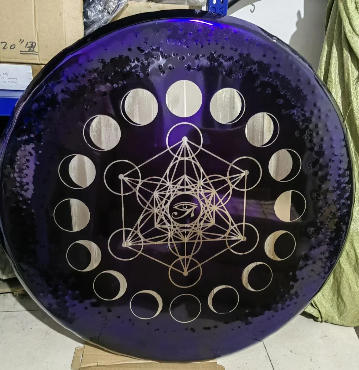 Circular purple disc illustrating moon phases and Metatron’s Cube in Purple Horus Eye Gong