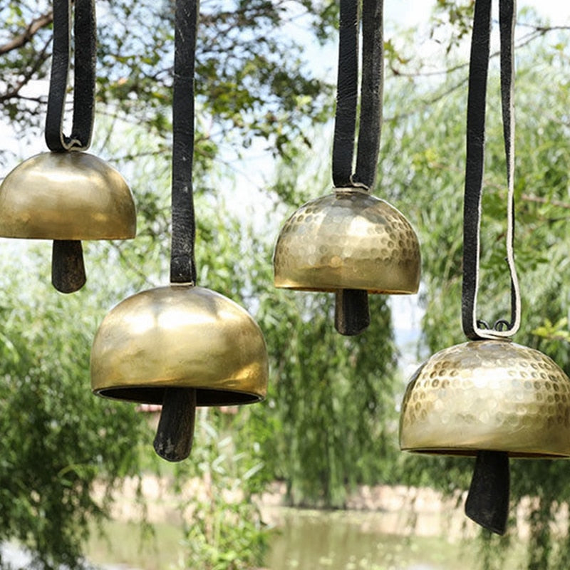 Brass bells with black leather straps on Tibetan Meditation Bell Instrument
