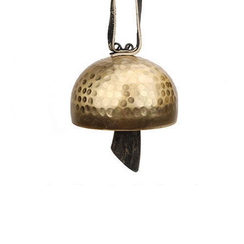 Hammered brass Tibetan Meditation Bell Instrument with dark clapper hanging below
