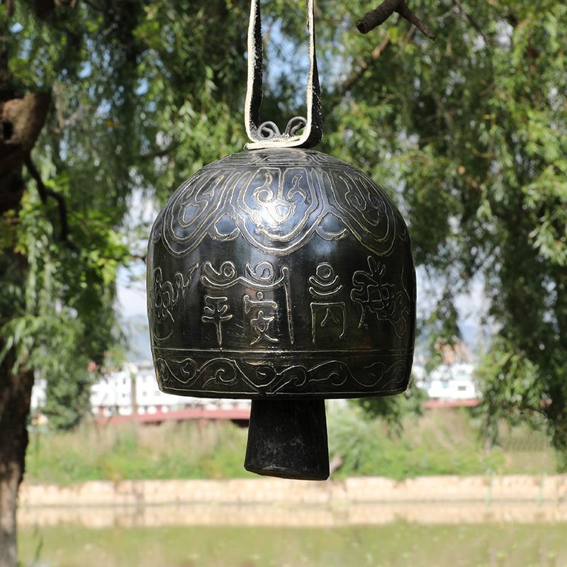 Black metal Tibetan Meditation Bell with decorative etched patterns for relaxation